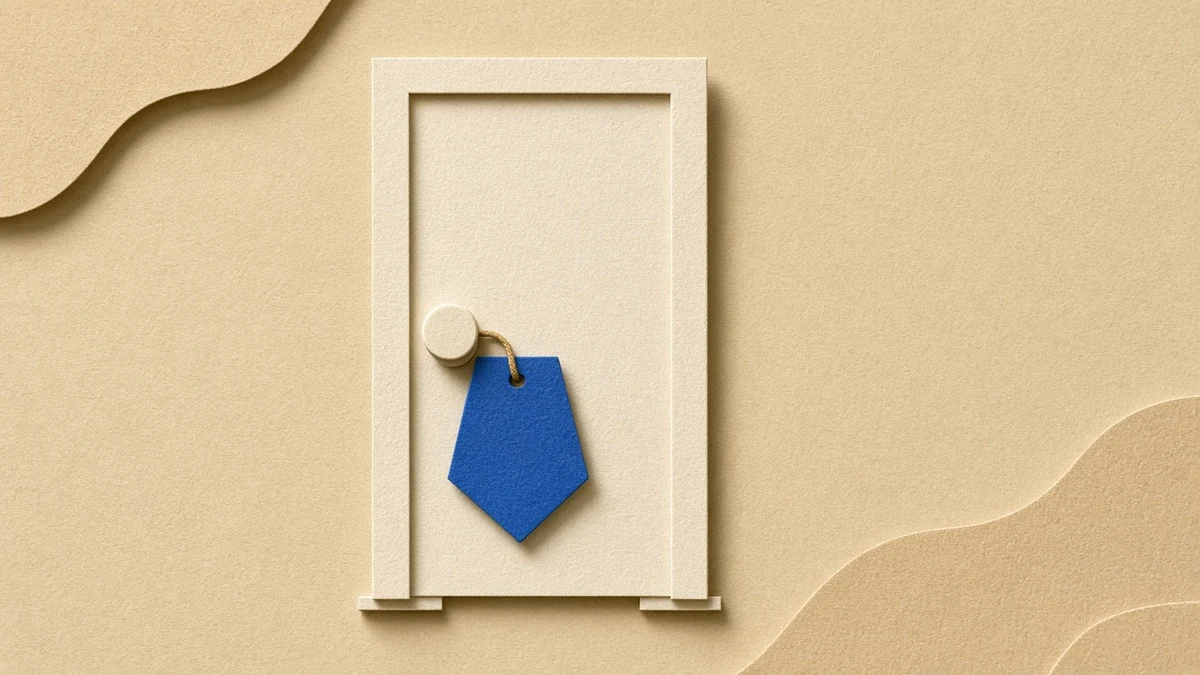 Paper cut-out of a closed door with a blue sign shape hanging below the handle, a simple signal for focus time at home.
