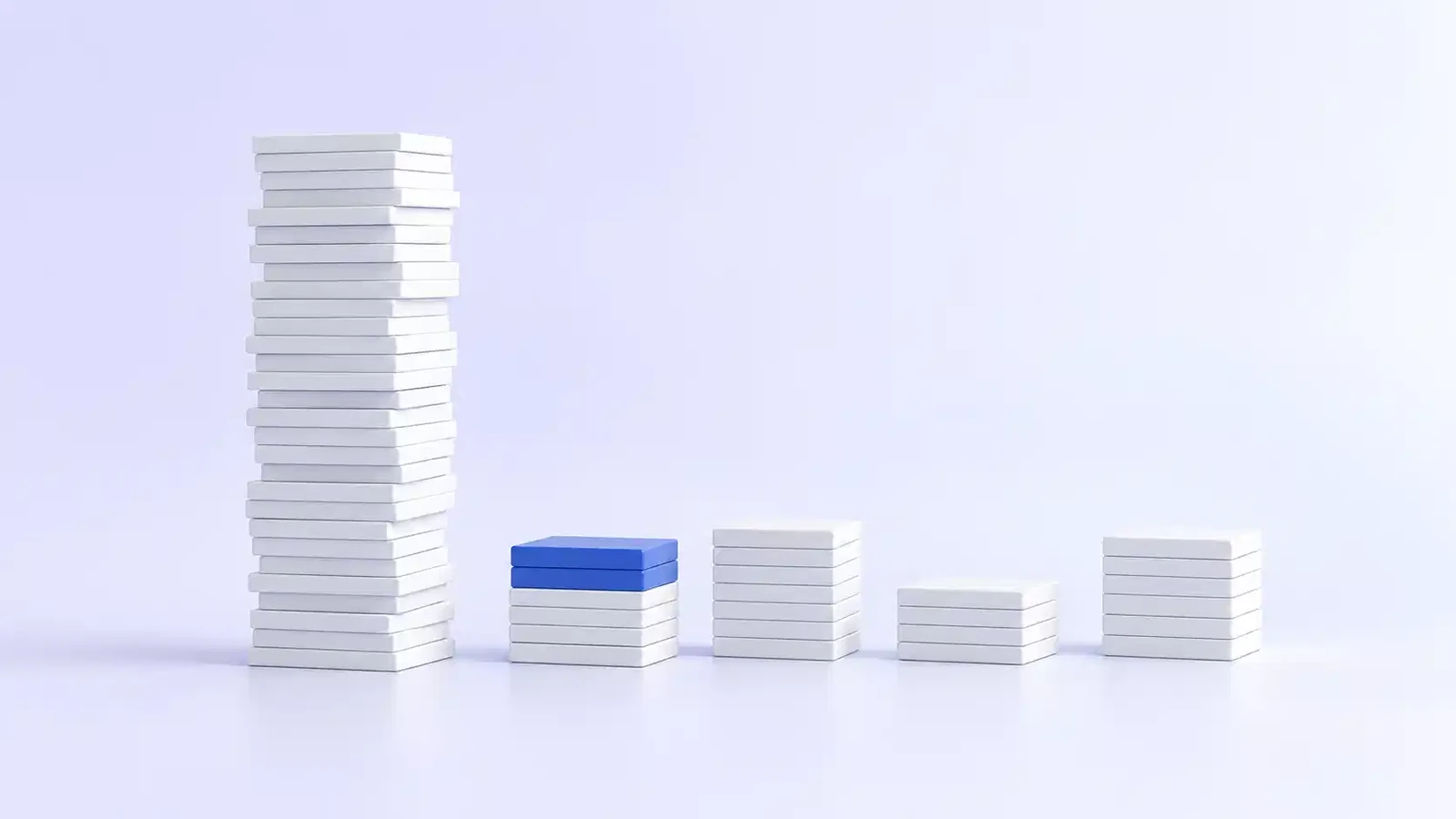 One tall, uneven stack of tiles beside four short, tidy stacks sorted from it, with a blue tile on top of the nearest stack.